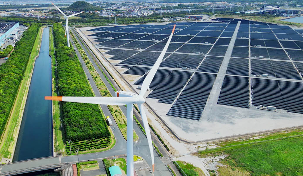 Solar power plant and Windmills aerial view. Renewable energy. Green tech.